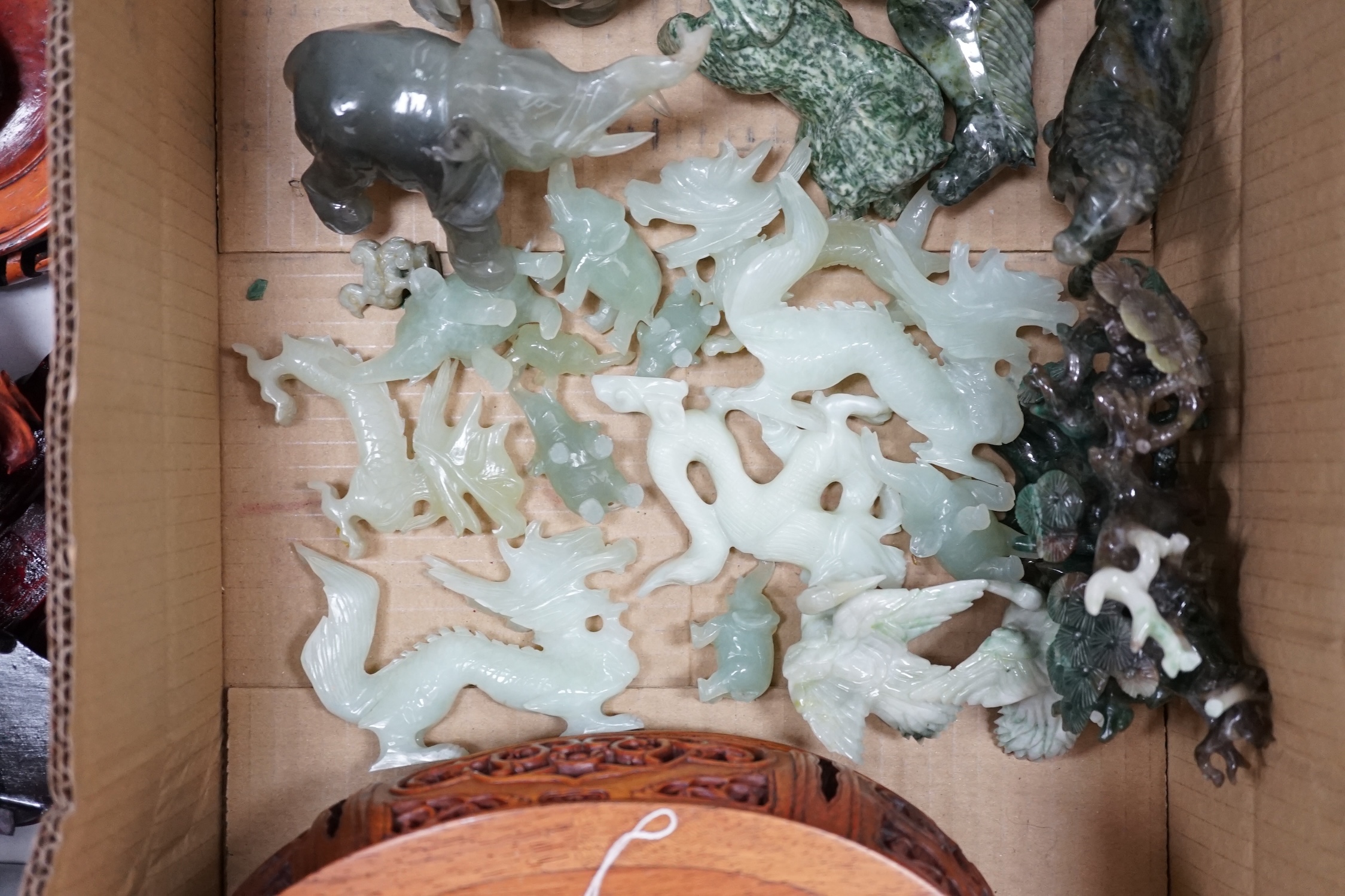 Assorted Chinese carvings, including enamel model bonsai trees, miniature ceramic folding screen, carved elephants, hardwood stands, and nephrite jade and green stone carved dragons, and horses, etc. Condition - varies